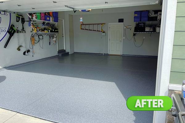Polyaspartic concrete floor coating in speckled flaked gray color with color quartz broadcast , featuring the fast 1-day installation.